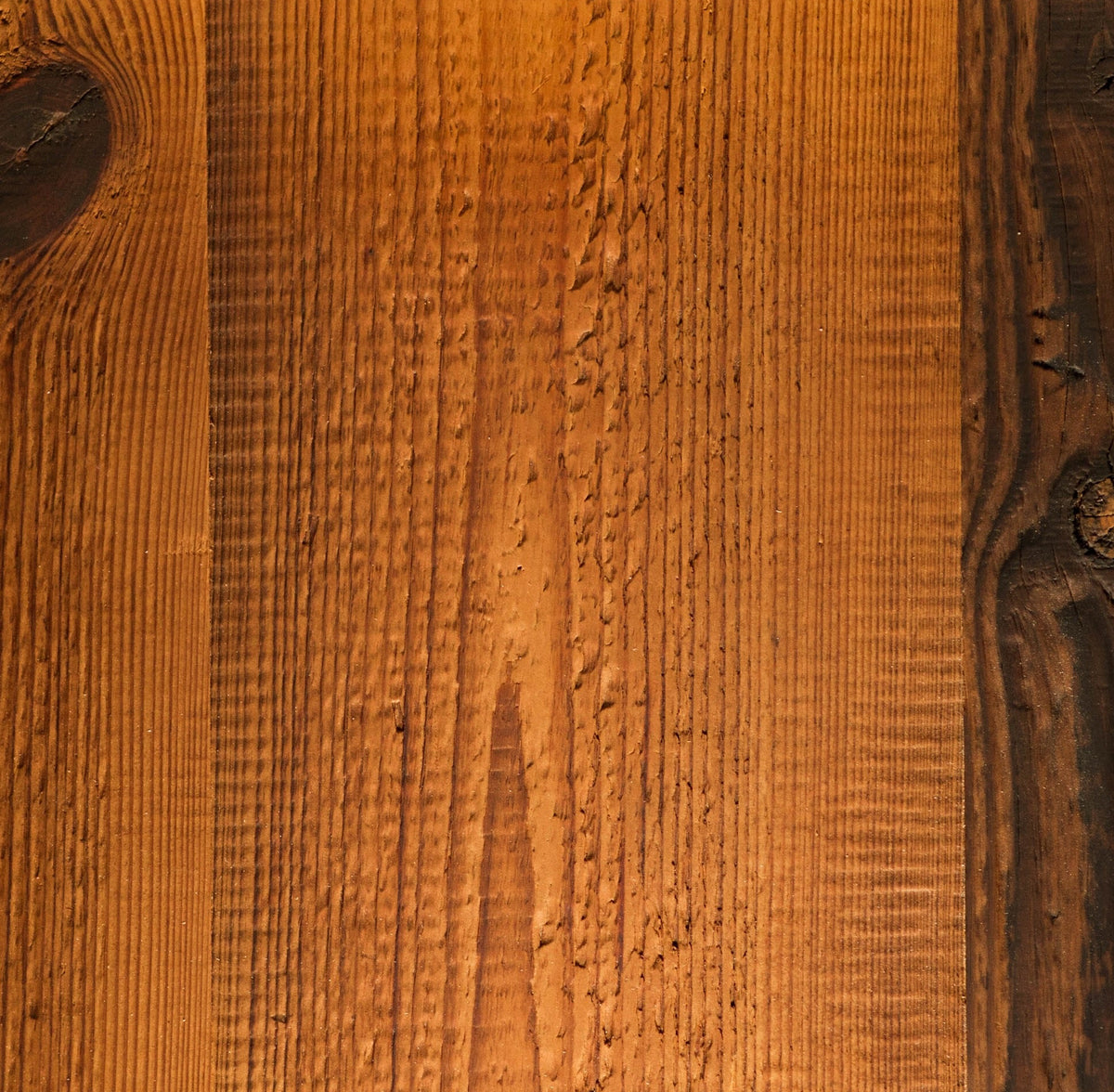 A square wooden sample or panel with a warm honey-brown wood grain texture and darker knots, For shelves and worktops.