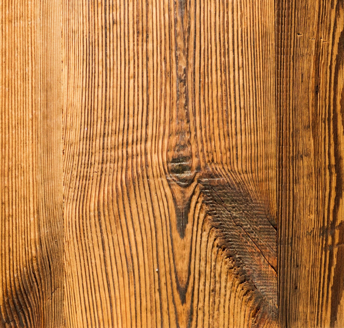 A sample of rustic wood door cupboard with prominent grain and knots,