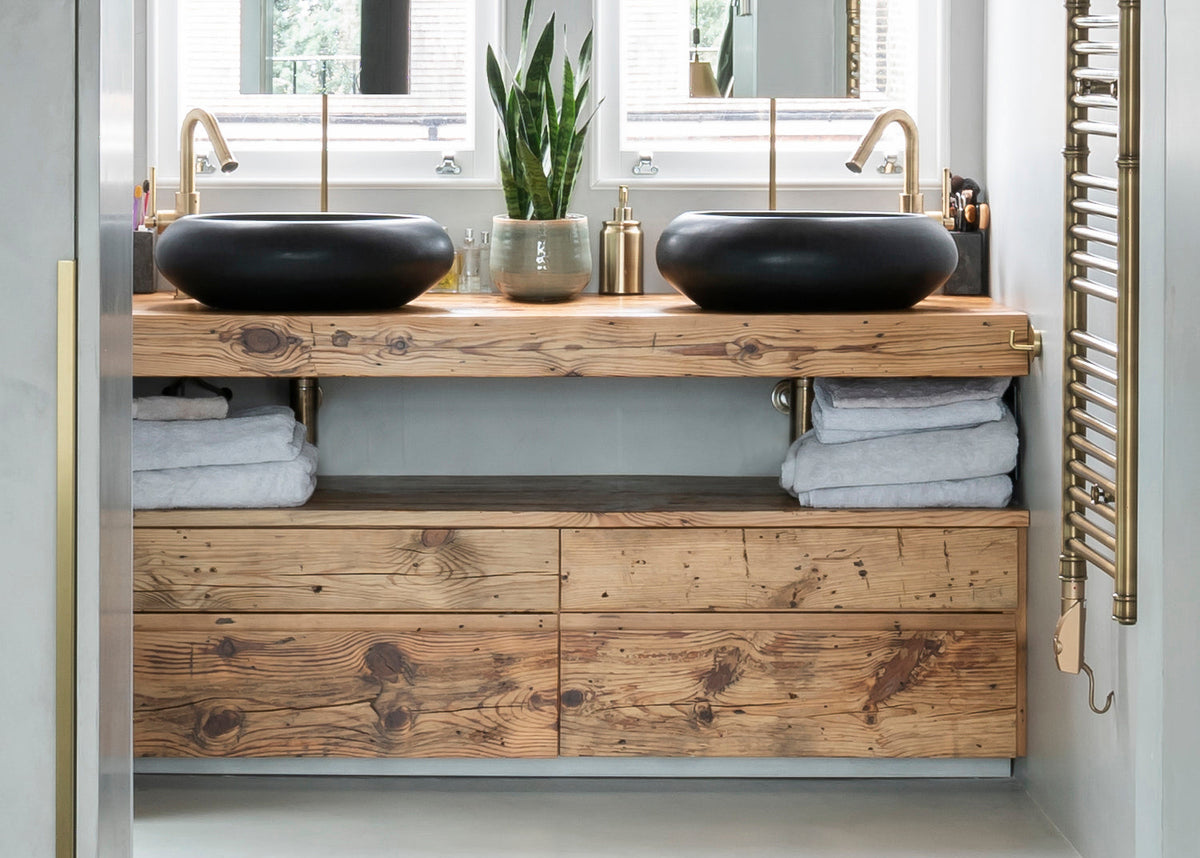 Double basin bathroom vanity crafted from reclaimed barn wood with brass taps, black vessel sinks and open storage shelving