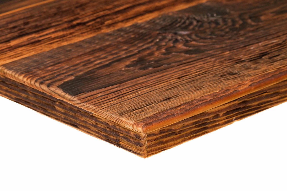 Close-up of a deep rustic brown reclaimed barn wood panel edge showing rich patina and textured grain.