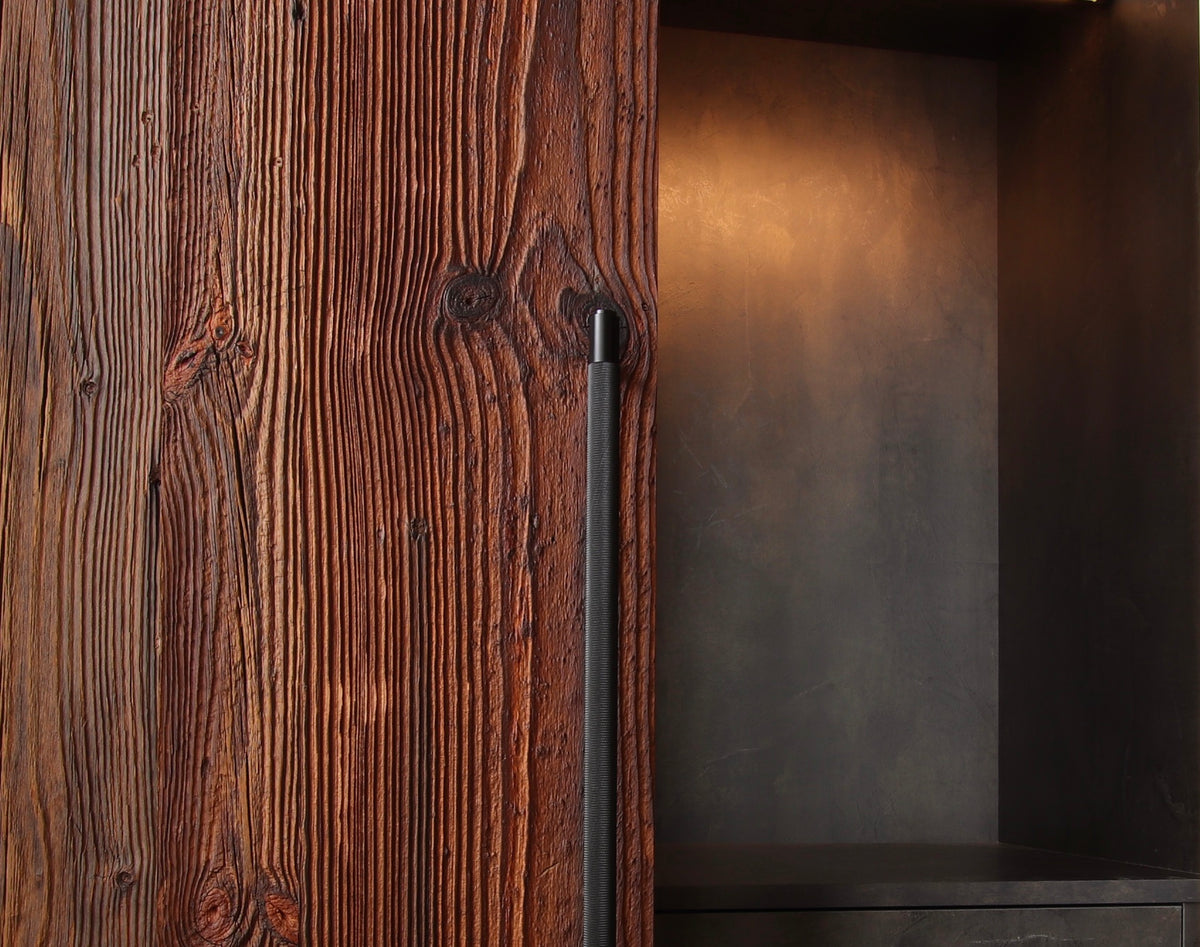 Characterful reclaimed barn wood wardrobe cabinet made from solid real wood with black metal handle and dark interior shelving and lighting